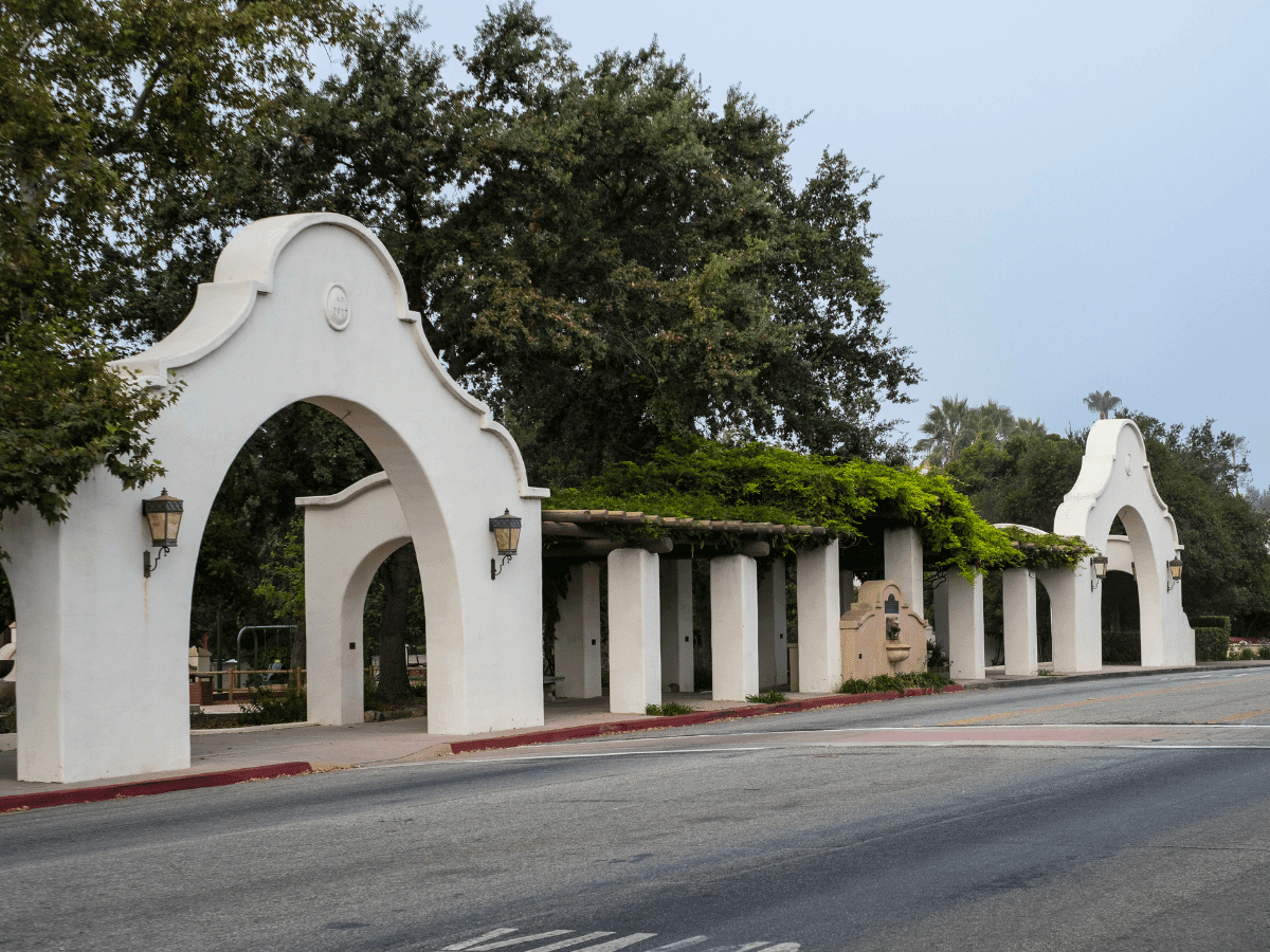 Spanish-style arches and tree-lined streets in Ojai, California.