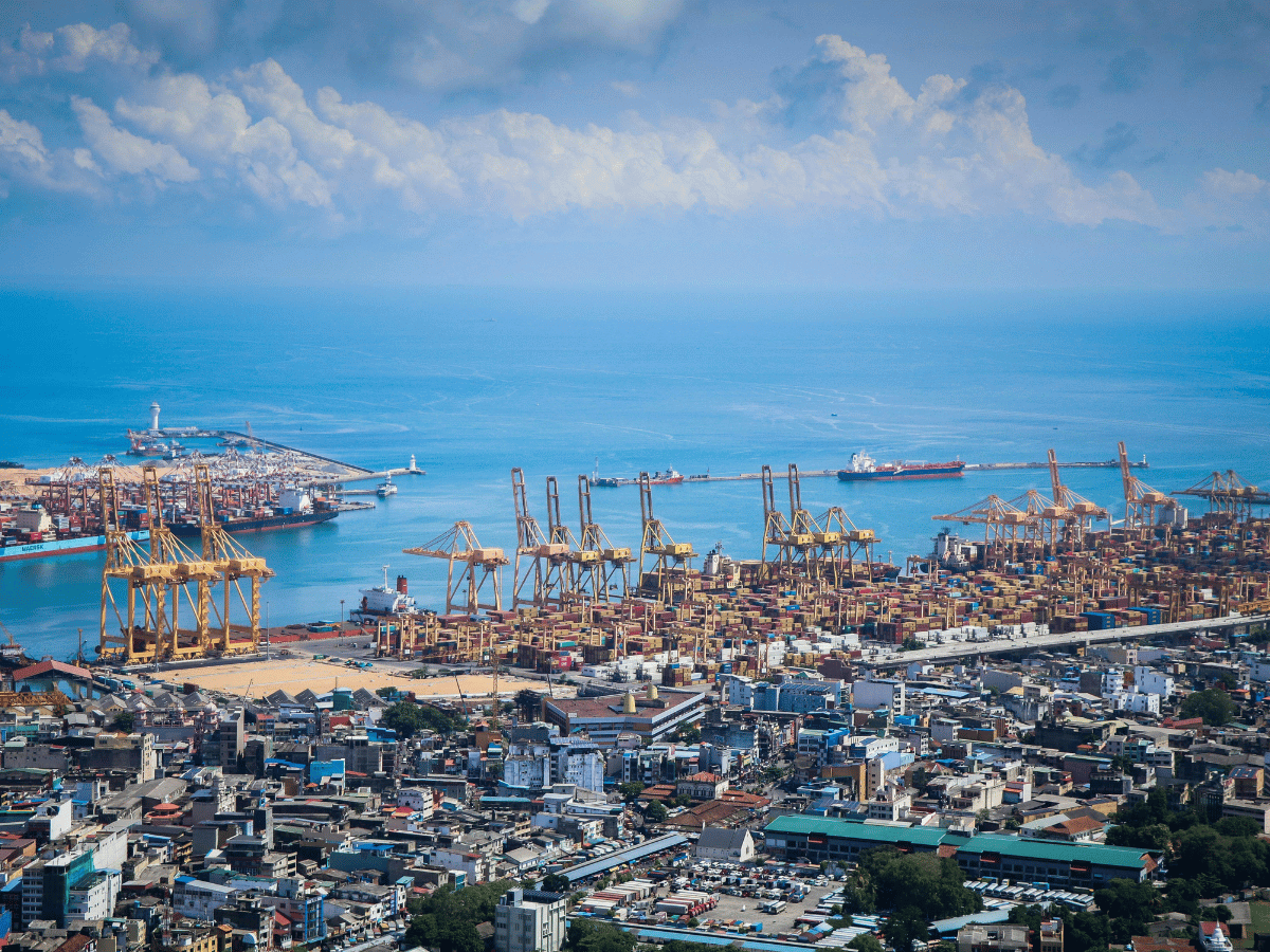 Aerial view of Port Hueneme, California featuring the harbor, shipping terminals, and Pacific coastline.