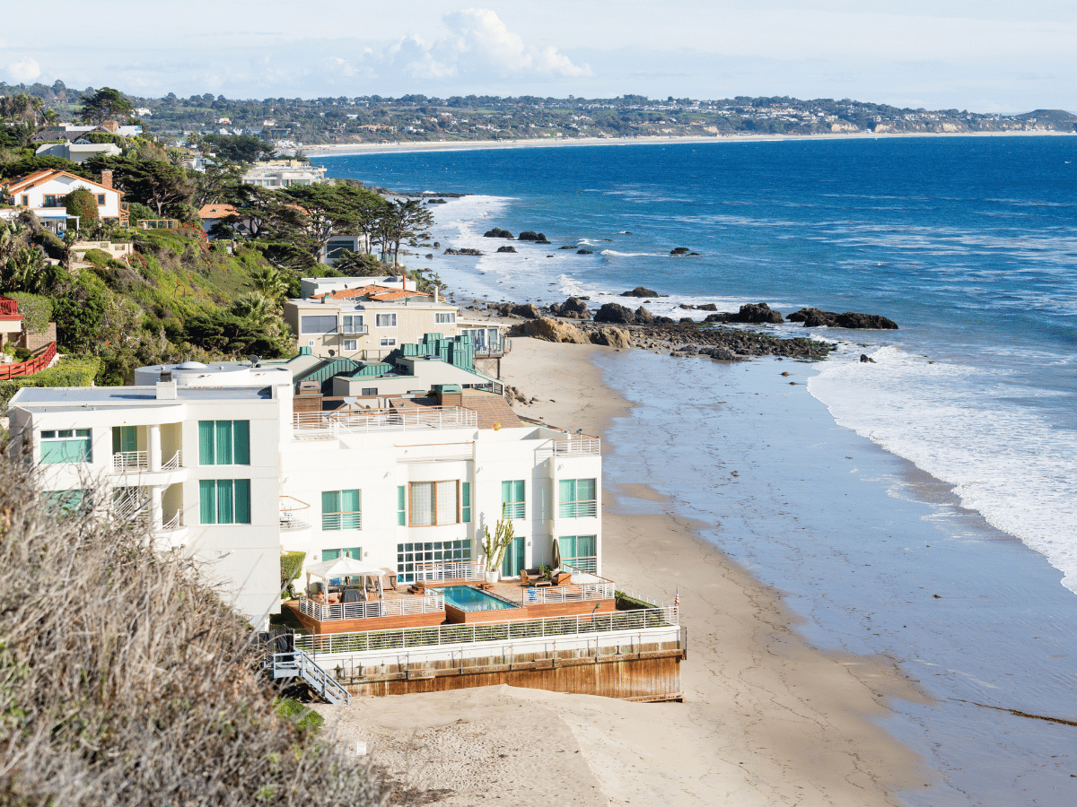 Oceanfront homes and scenic coastline along Malibu, California.