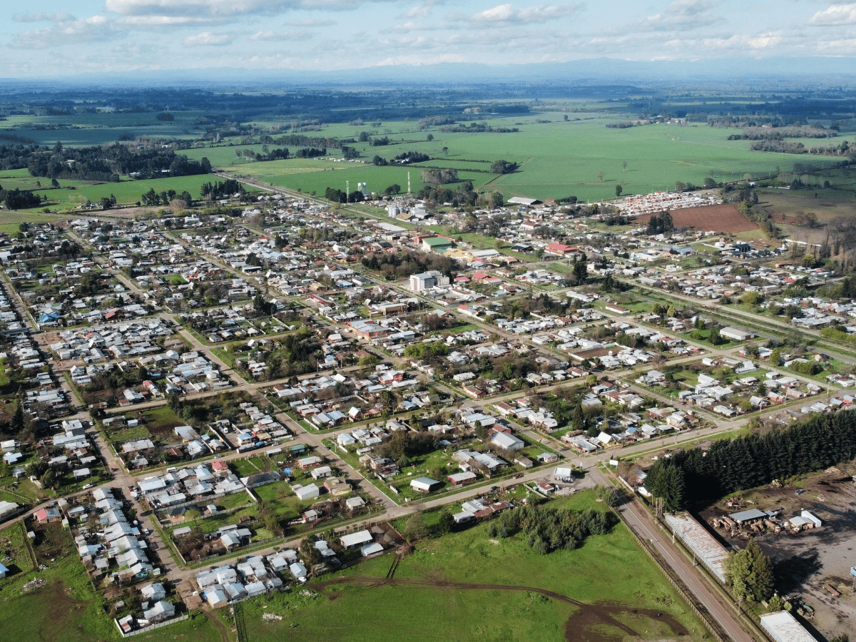 Aerial view of Oxnard, California featuring residential neighborhoods and surrounding farmland.