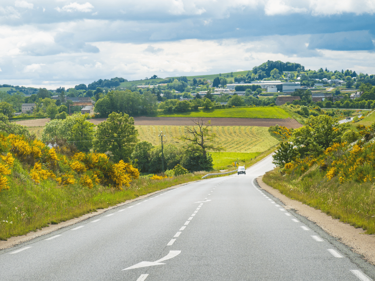 Scenic countryside road and rolling green hills in Woodland Hills, California.