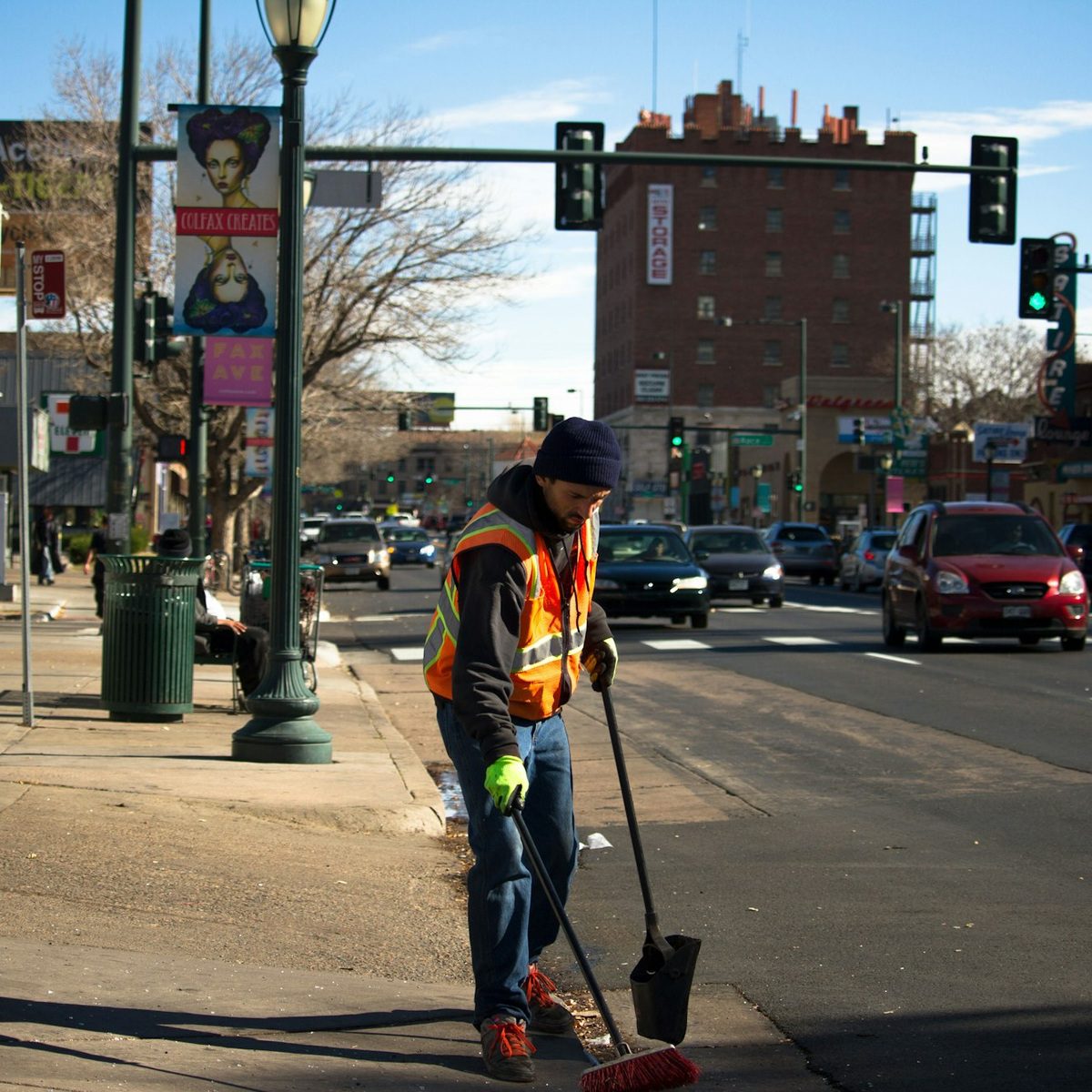 Street cleaning worker sweeping curbside debris for HOA sweeping in Los Angeles, CA
